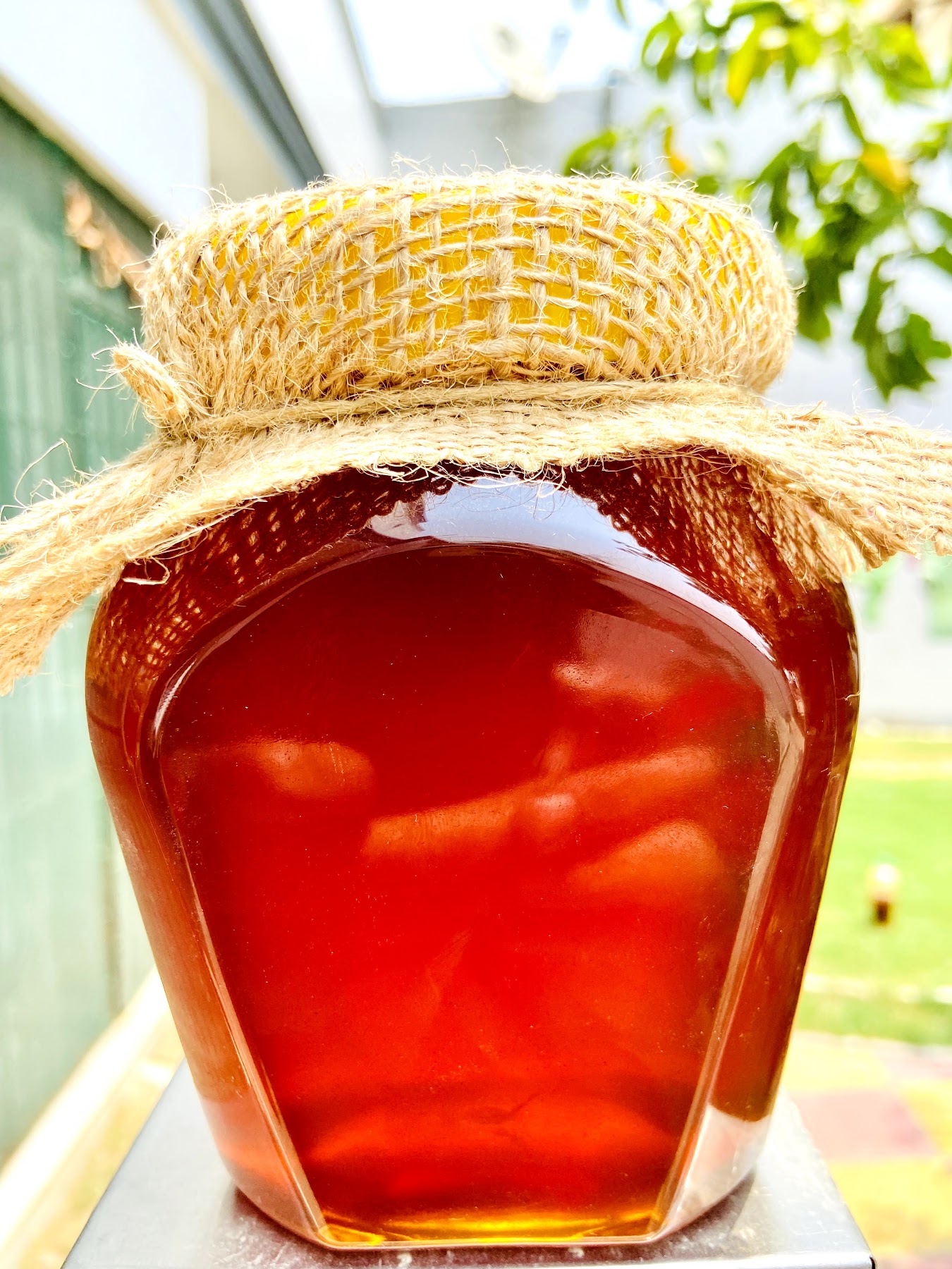 Close view of the Dhiman Honey Bee jar and natural fibre cover